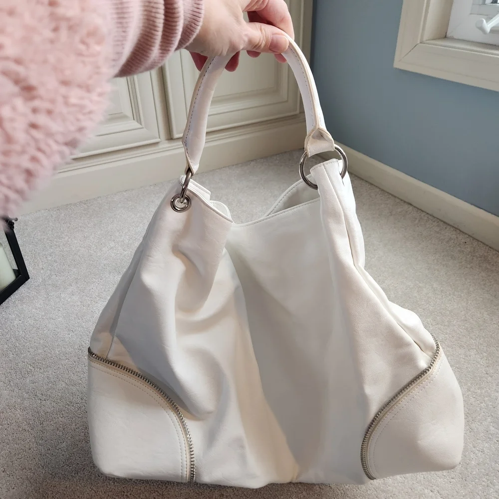 Express White Handbag with Silver Zipper Details, Snap Closure